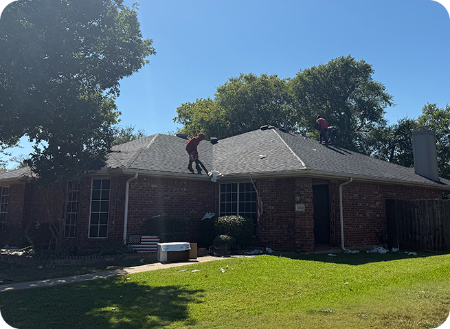 Pinnacle Home Services roofing crew installing a new roof on a home in the Dallas–Fort Worth area on a bright sunny day.
